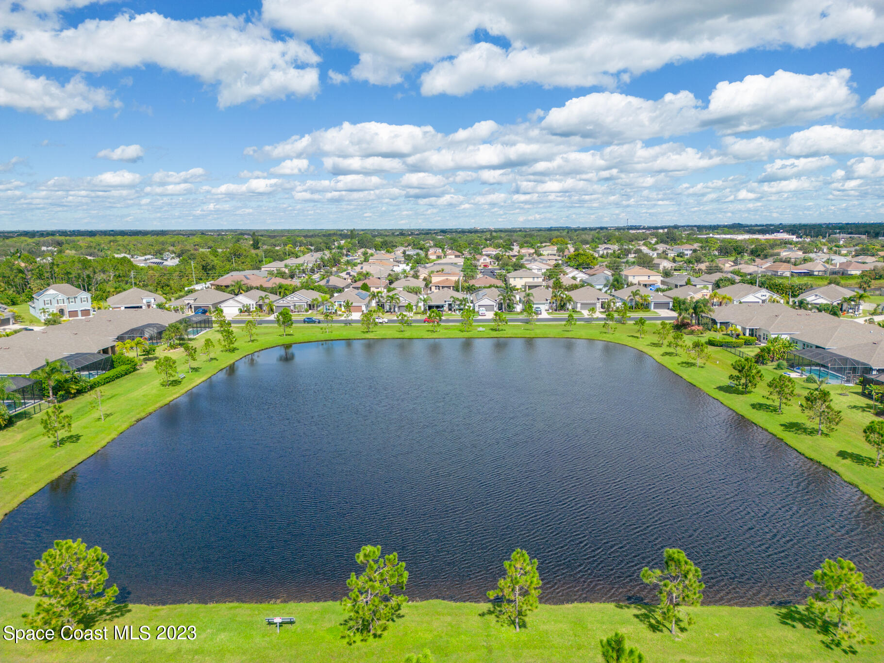 4465 Ruthann Circle Melbourne, FL 32934 - Photo 39 of 42 a view of a lake with a city