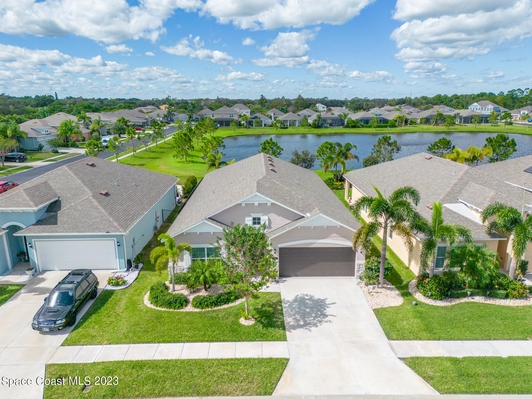 4465 Ruthann Circle Melbourne, FL 32934 - Photo 40 of 42 an aerial view of a house with garden space and street view
