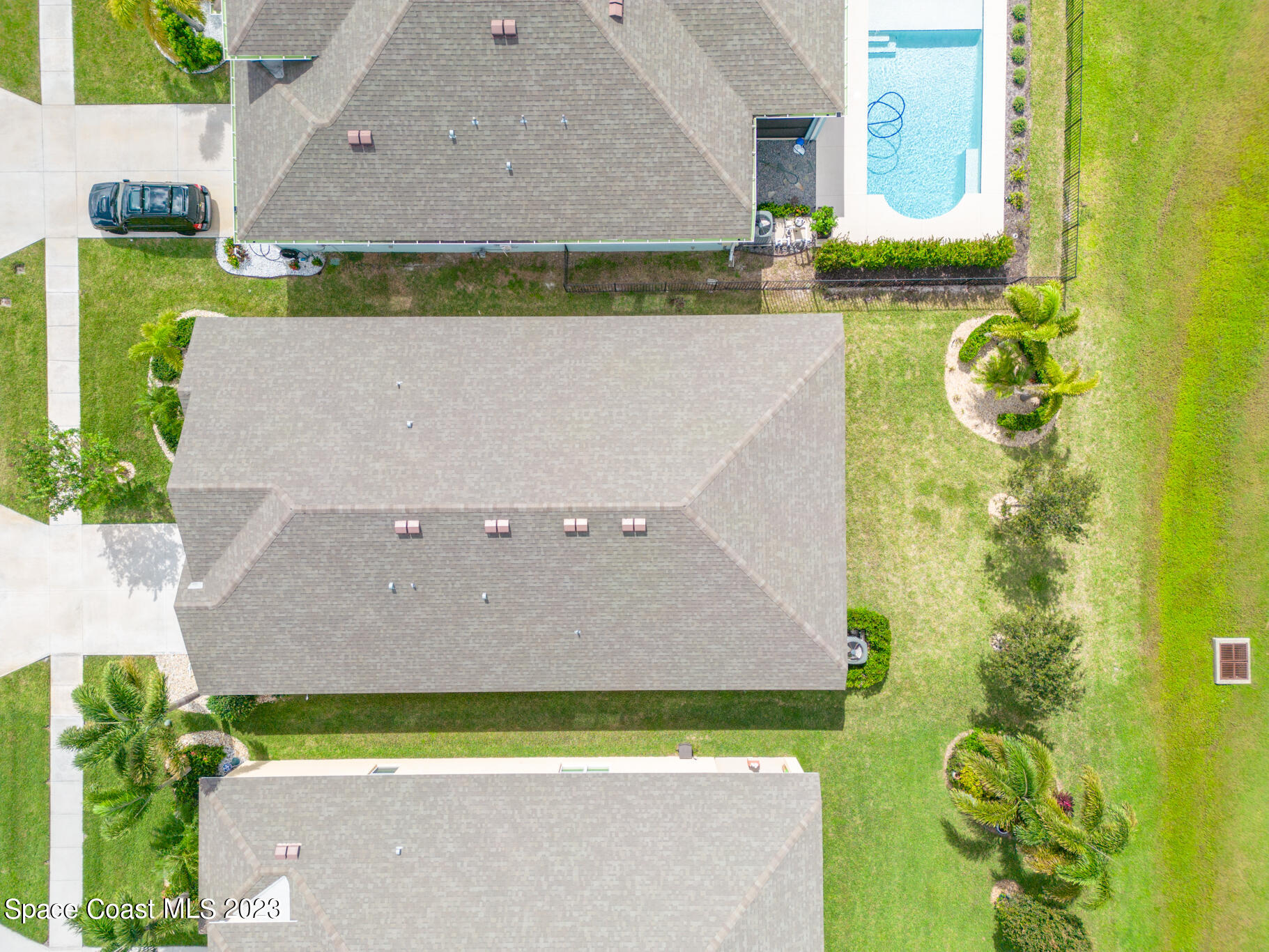 4465 Ruthann Circle Melbourne, FL 32934 - Photo 41 of 42 an aerial view of a house with a swimming pool