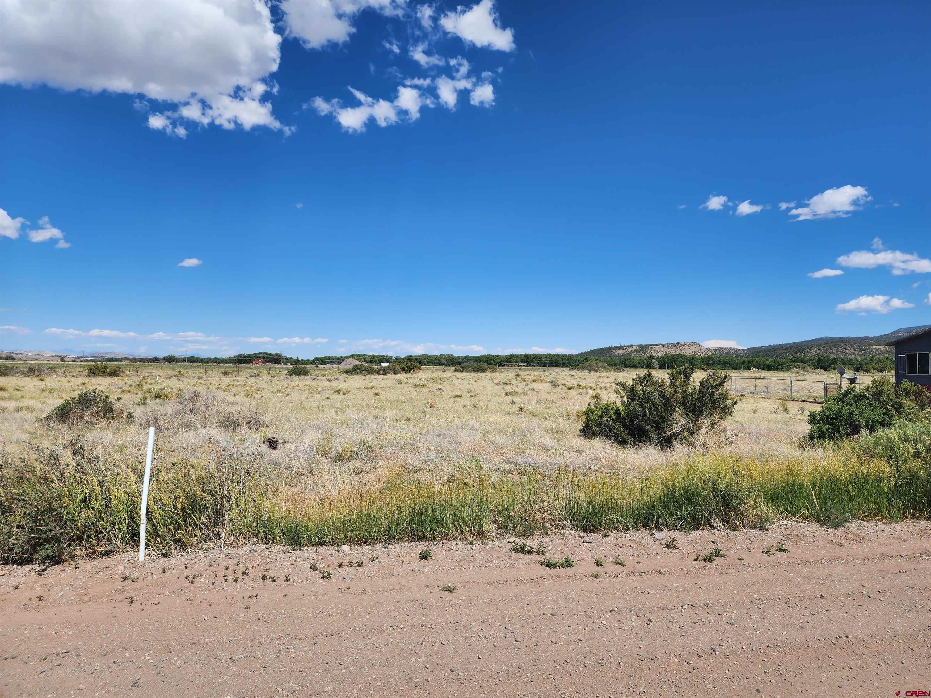 337 Pink Cloud Road South Fork, CO 81154 - Photo 1 of 10 a view of a beach next to a yard