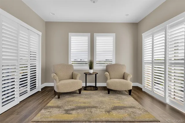 a living room with furniture and windows