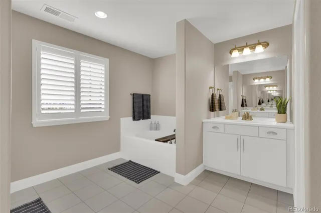 a bathroom with a sink toilet and tub