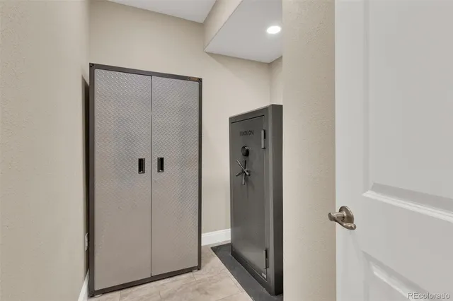 a view of a hallway with closet and front door