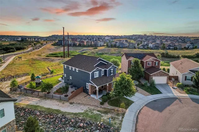 an aerial view of a house with a garden