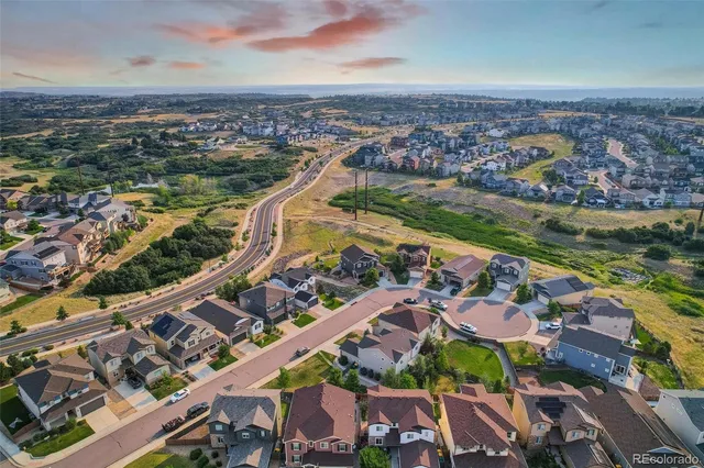 an aerial view of residential building and lake
