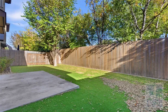 a view of a backyard with a small cabin