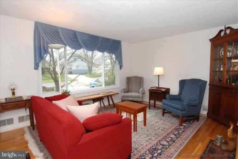 10403 Procter Street Silver Spring, MD 20901 - Photo 6 of 11 a living room with furniture and a large window