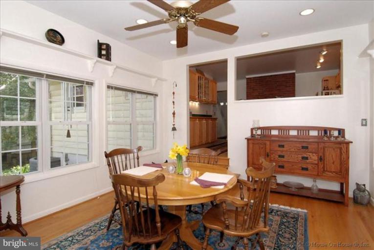 10403 Procter Street Silver Spring, MD 20901 - Photo 10 of 11 a view of a dining room with furniture and wooden floor