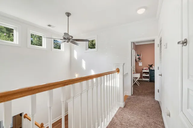 a view of a hallway view with staircase