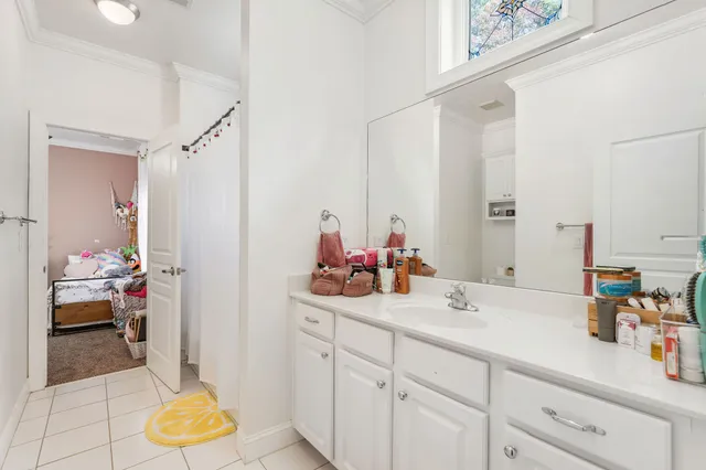 a en suite bathroom with a sink mirror and vanity