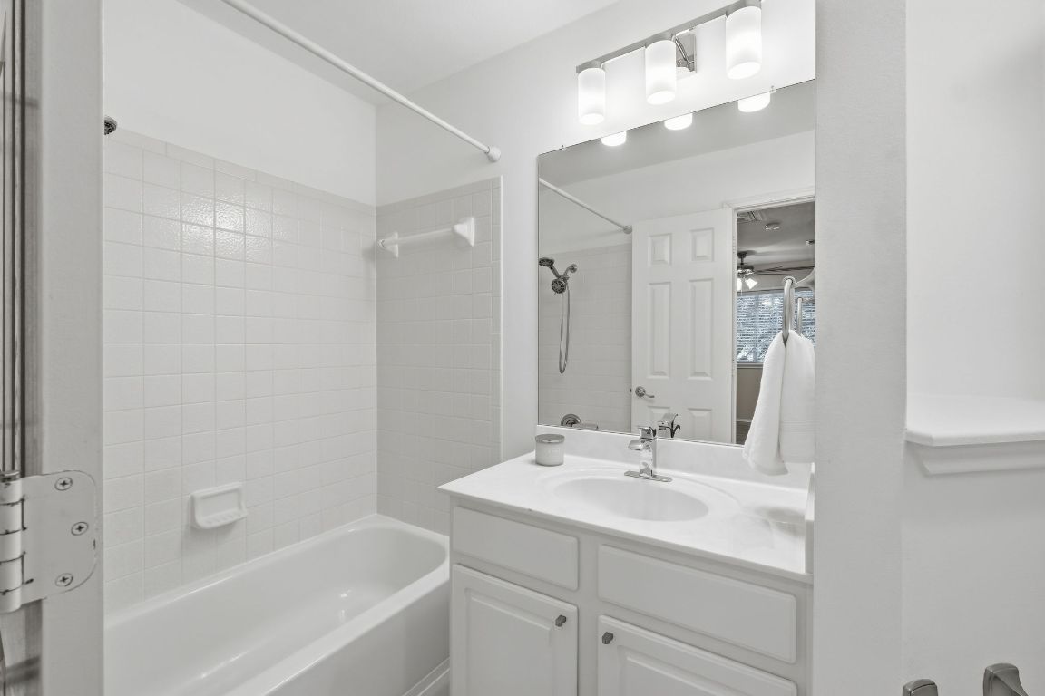 1900 Scofield Ridge Parkway, Unit 203 Austin, TX 78727 - Photo 21 of 31 Full bath featuring washtub / shower combination and vanity