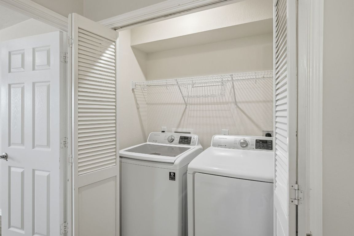 1900 Scofield Ridge Parkway, Unit 203 Austin, TX 78727 - Photo 22 of 31 Laundry area featuring separate washer and dryer
