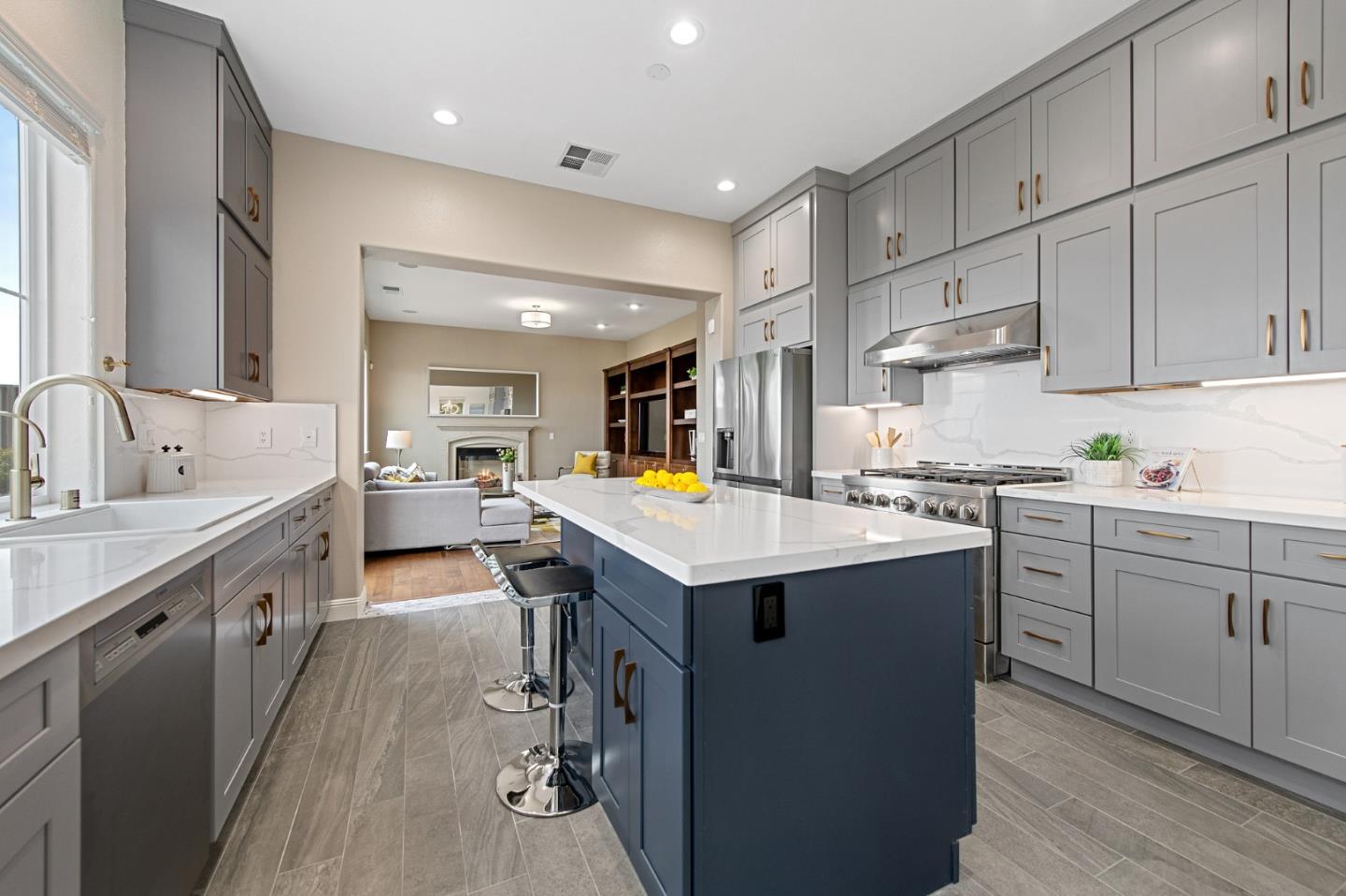 9 Estates Drive Millbrae, CA 94030 - Photo 18 of 52 a kitchen with white cabinets sink and stove