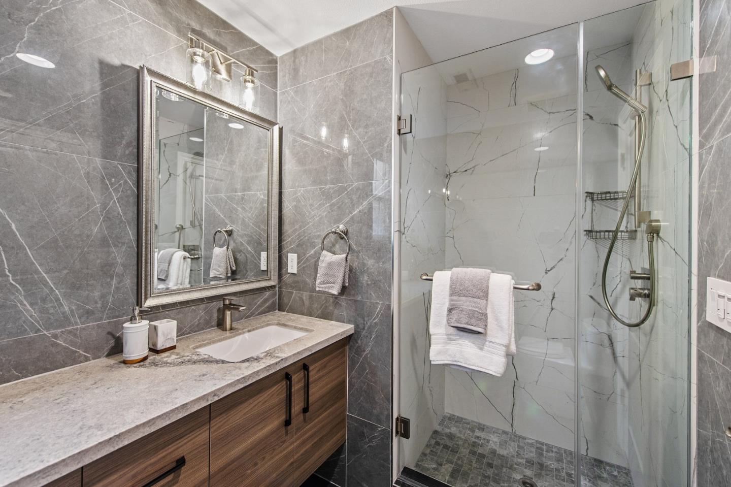 9 Estates Drive Millbrae, CA 94030 - Photo 23 of 52 a bathroom with a granite countertop sink a shower and a mirror