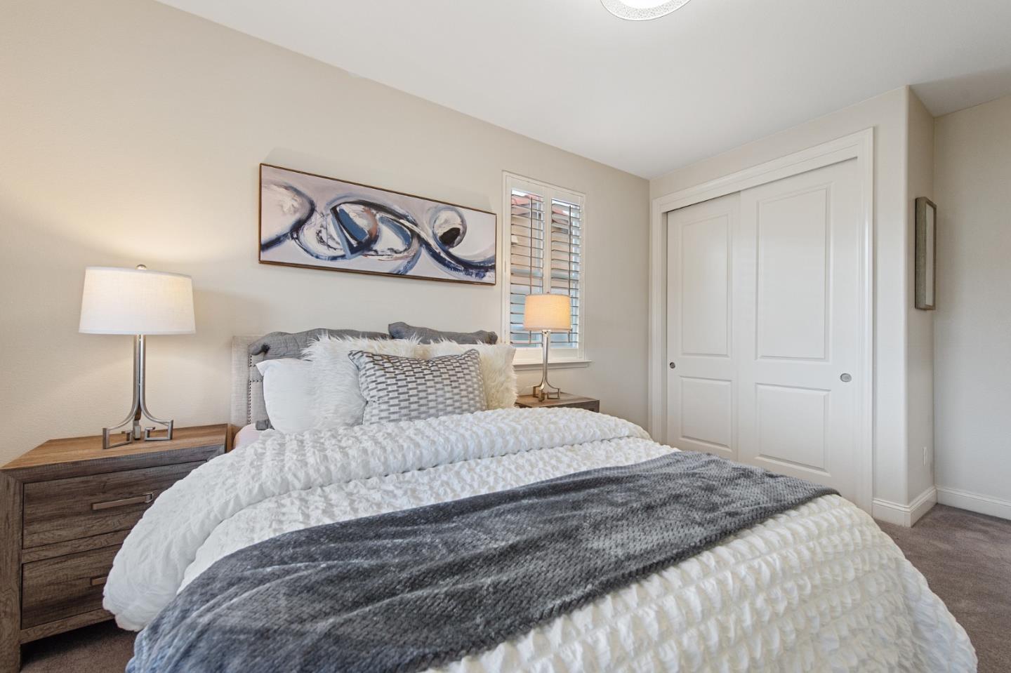 9 Estates Drive Millbrae, CA 94030 - Photo 39 of 52 a bedroom with a bed and a lamp on table