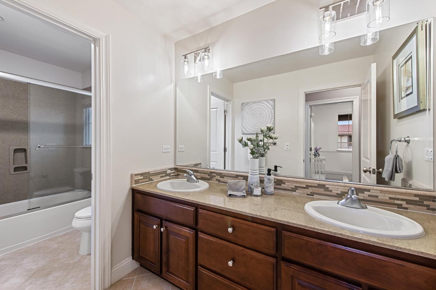 9 Estates Drive Millbrae, CA 94030 - Photo 40 of 52 a bathroom with a sink and a mirror