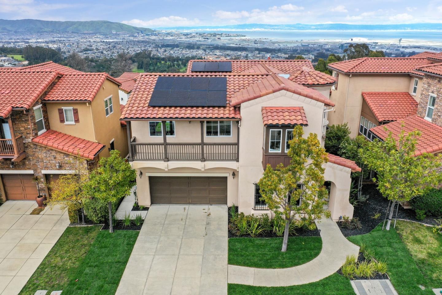 9 Estates Drive Millbrae, CA 94030 - Photo 48 of 52 a front view of a house with a yard and garage