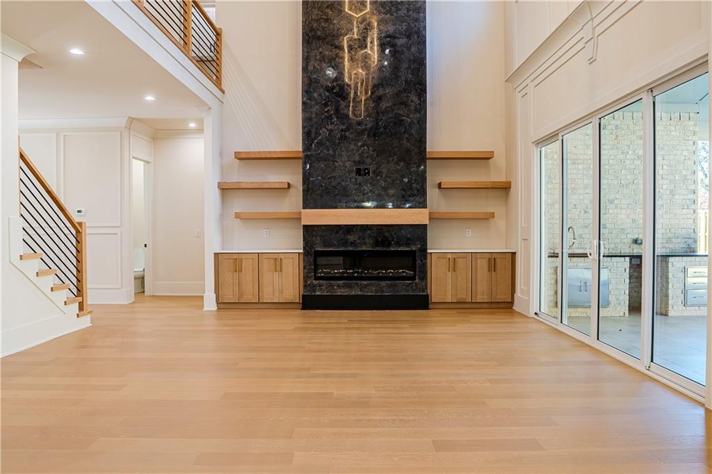 2210 Ridgedale Drive Southwest Grayson, GA 30017 - Photo 13 of 74 a view of an empty room with a fireplace and a window