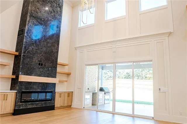 a view of kitchen with stainless steel appliances refrigerator and cabinets