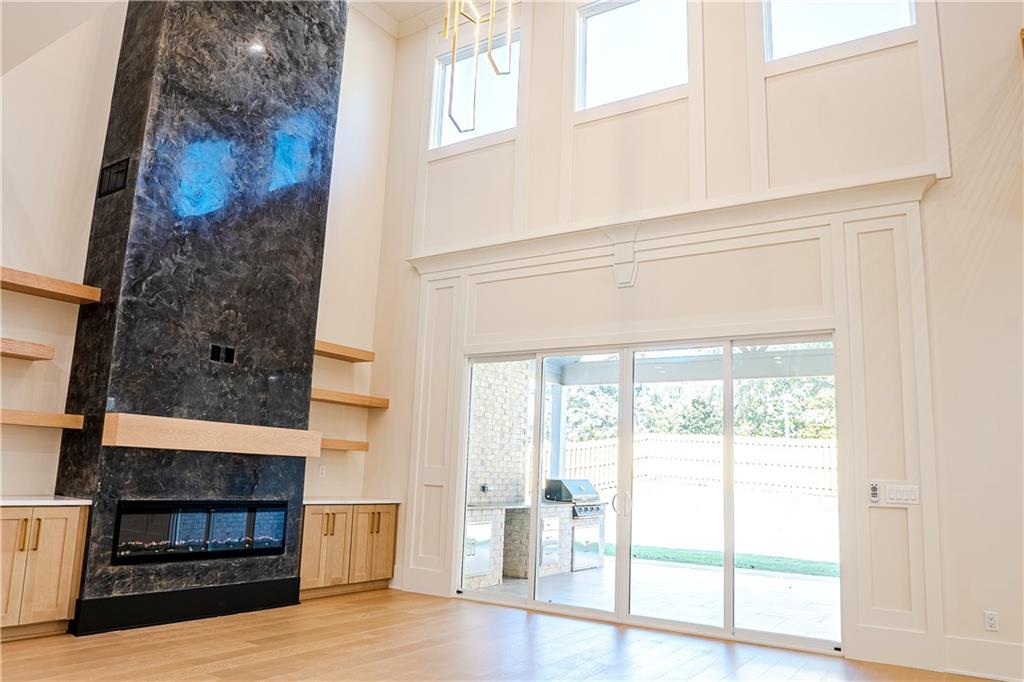 2210 Ridgedale Drive Southwest Grayson, GA 30017 - Photo 15 of 74 a view of a livingroom with wooden floor and a fireplace