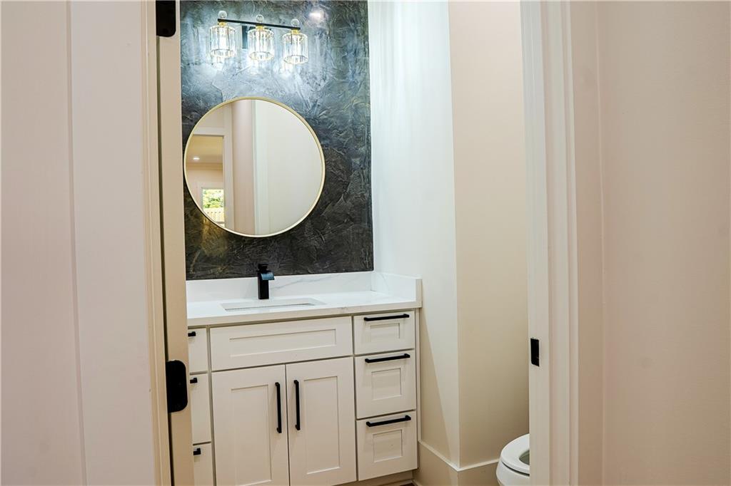 2210 Ridgedale Drive Southwest Grayson, GA 30017 - Photo 24 of 74 a bathroom with a sink and a mirror