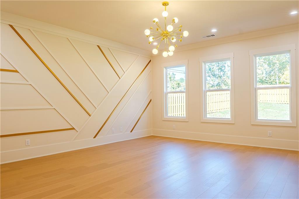 2210 Ridgedale Drive Southwest Grayson, GA 30017 - Photo 25 of 74 an empty room with wooden floor and windows