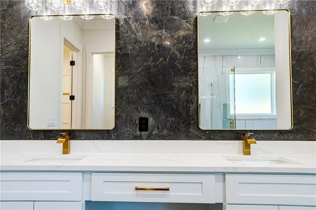 a view of an empty room with a window and fireplace