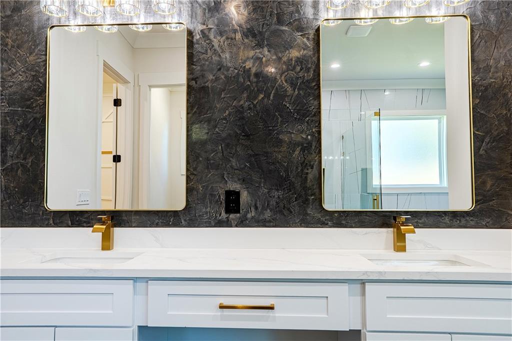 2210 Ridgedale Drive Southwest Grayson, GA 30017 - Photo 28 of 74 a bathroom with a sink and a mirror