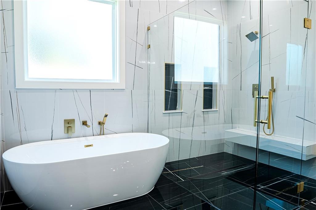 2210 Ridgedale Drive Southwest Grayson, GA 30017 - Photo 30 of 74 a white bath tub sitting next to a white sink