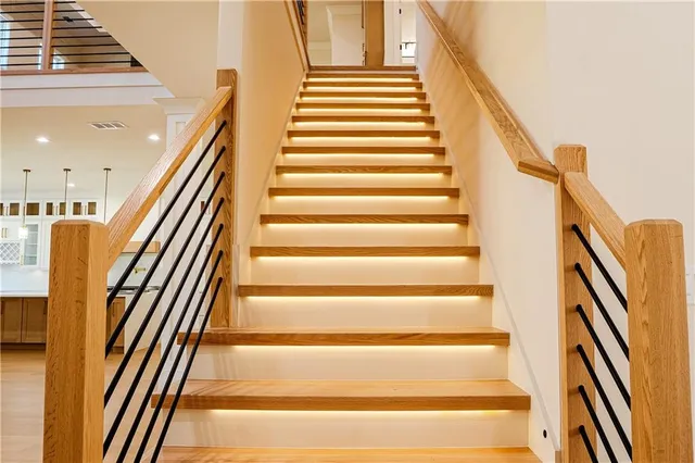 a bathroom with a shower sink vanity and toilet