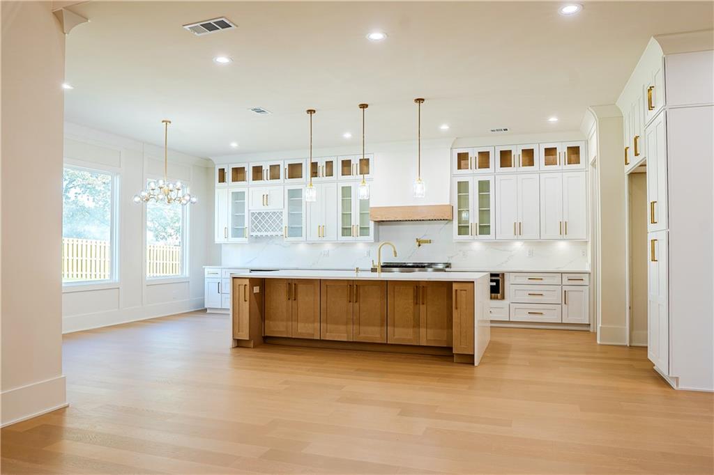 2210 Ridgedale Drive Southwest Grayson, GA 30017 - Photo 5 of 74 a large kitchen with stainless steel appliances kitchen island granite countertop a stove a sink a refrigerator and a granite counter tops