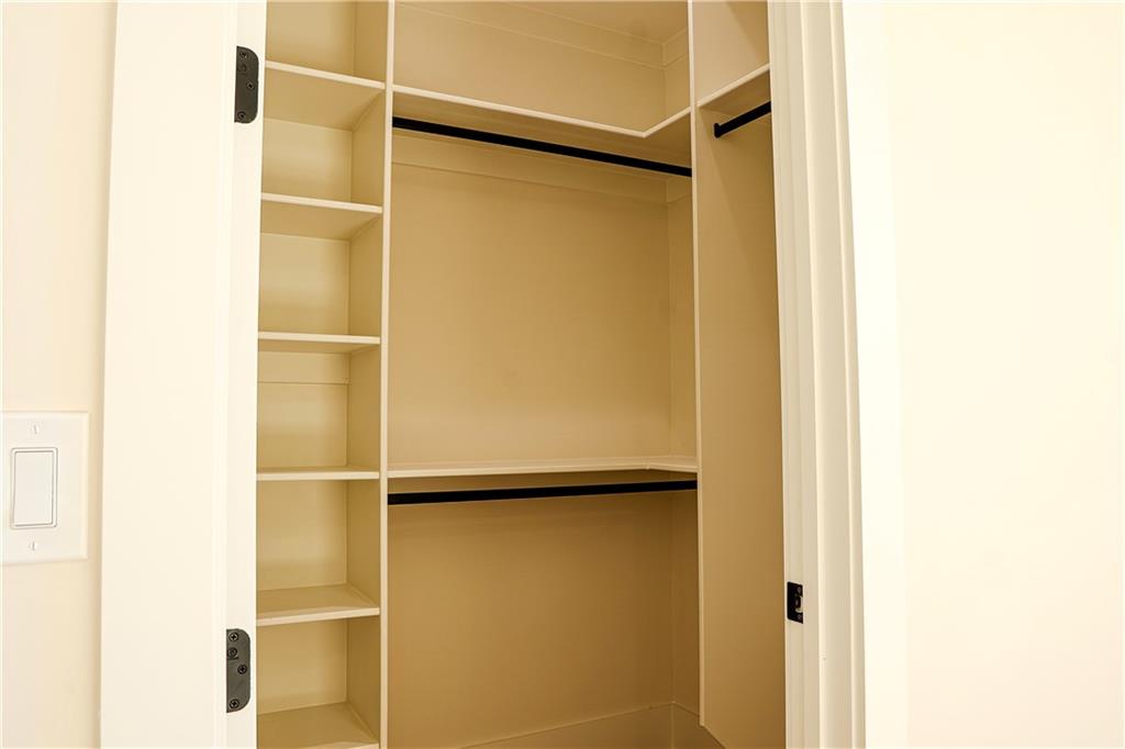 2210 Ridgedale Drive Southwest Grayson, GA 30017 - Photo 56 of 74 a bathroom with a glass door shower and a sink