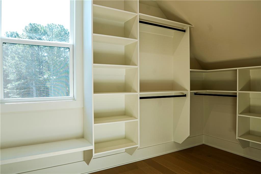 2210 Ridgedale Drive Southwest Grayson, GA 30017 - Photo 60 of 74 a bathroom with a glass shower door