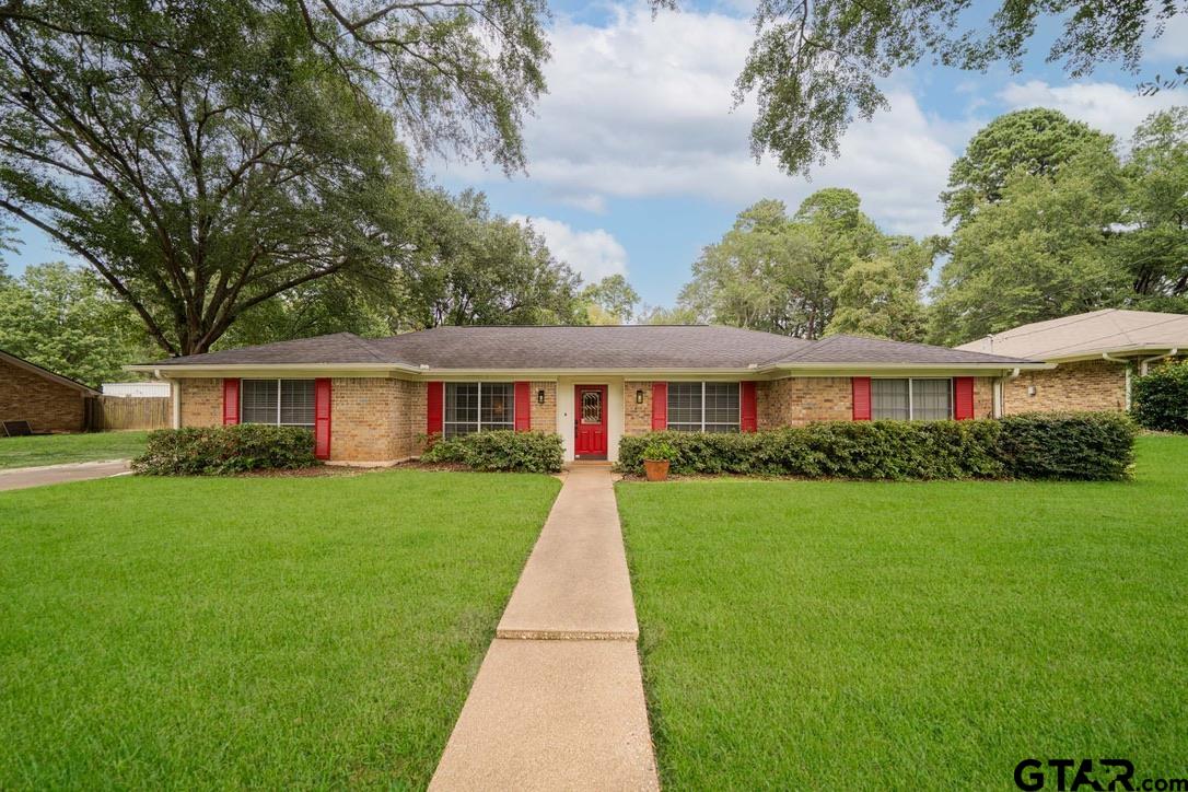 a front view of a house with yard