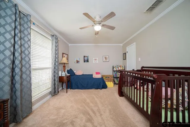 a very nice looking room with a large window and flat screen tv