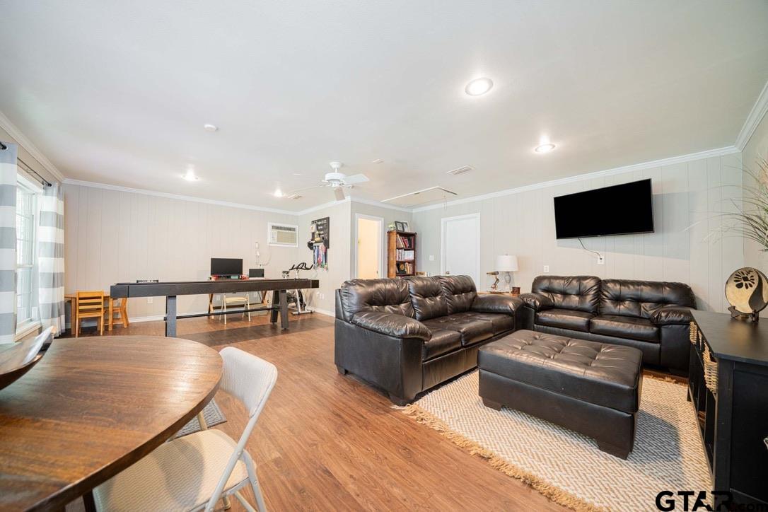 607 Green Oak Drive Longview, TX 75604 - Photo 16 of 48 a living room with furniture and a flat screen tv