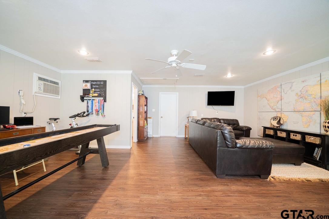 607 Green Oak Drive Longview, TX 75604 - Photo 19 of 48 a living room with furniture and a flat screen tv