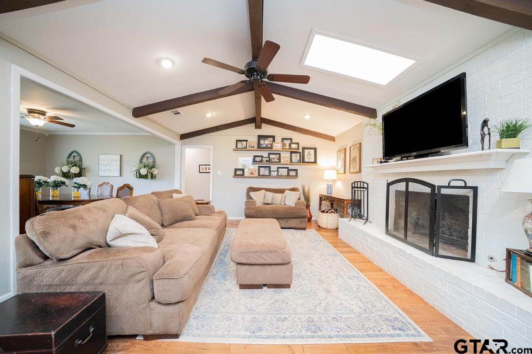 607 Green Oak Drive Longview, TX 75604 - Photo 3 of 48 a living room with furniture and a flat screen tv
