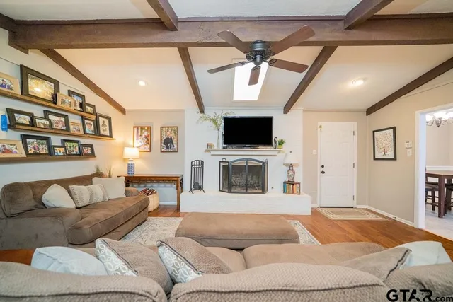 a bedroom with a large bed and a flat screen tv
