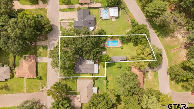 aerial view of residential houses with outdoor space