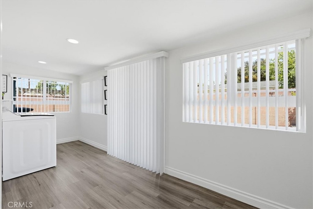 533 South Devon Road Orange, CA 92868 - Photo 49 of 50 a view of an empty room with wooden floor and a window