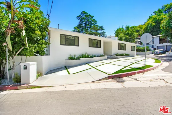 a house with trees in the background