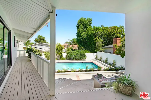 a view of a house with swimming pool