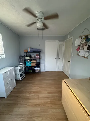 a room with a bed and furniture