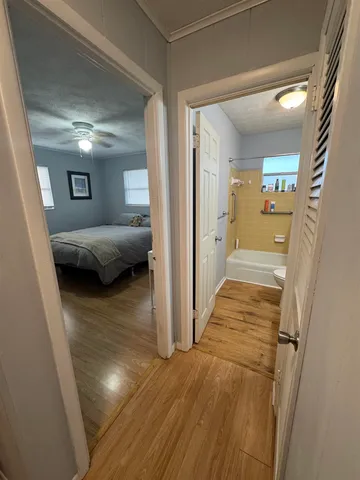 a view of a bedroom from a hallway