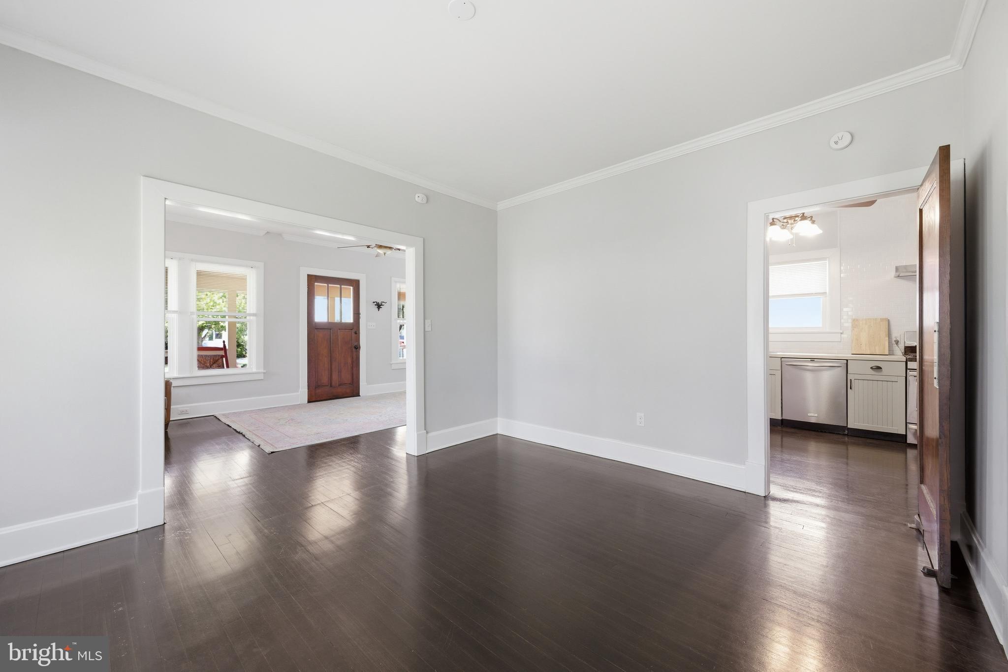 106 Main Street Preston, MD 21655 - Photo 15 of 31 a view of an empty room with a window and wooden floor