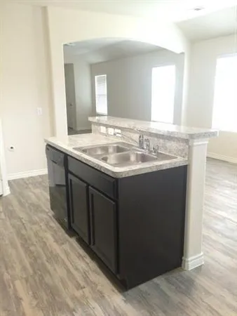 a bathroom with a granite countertop sink a mirror and a