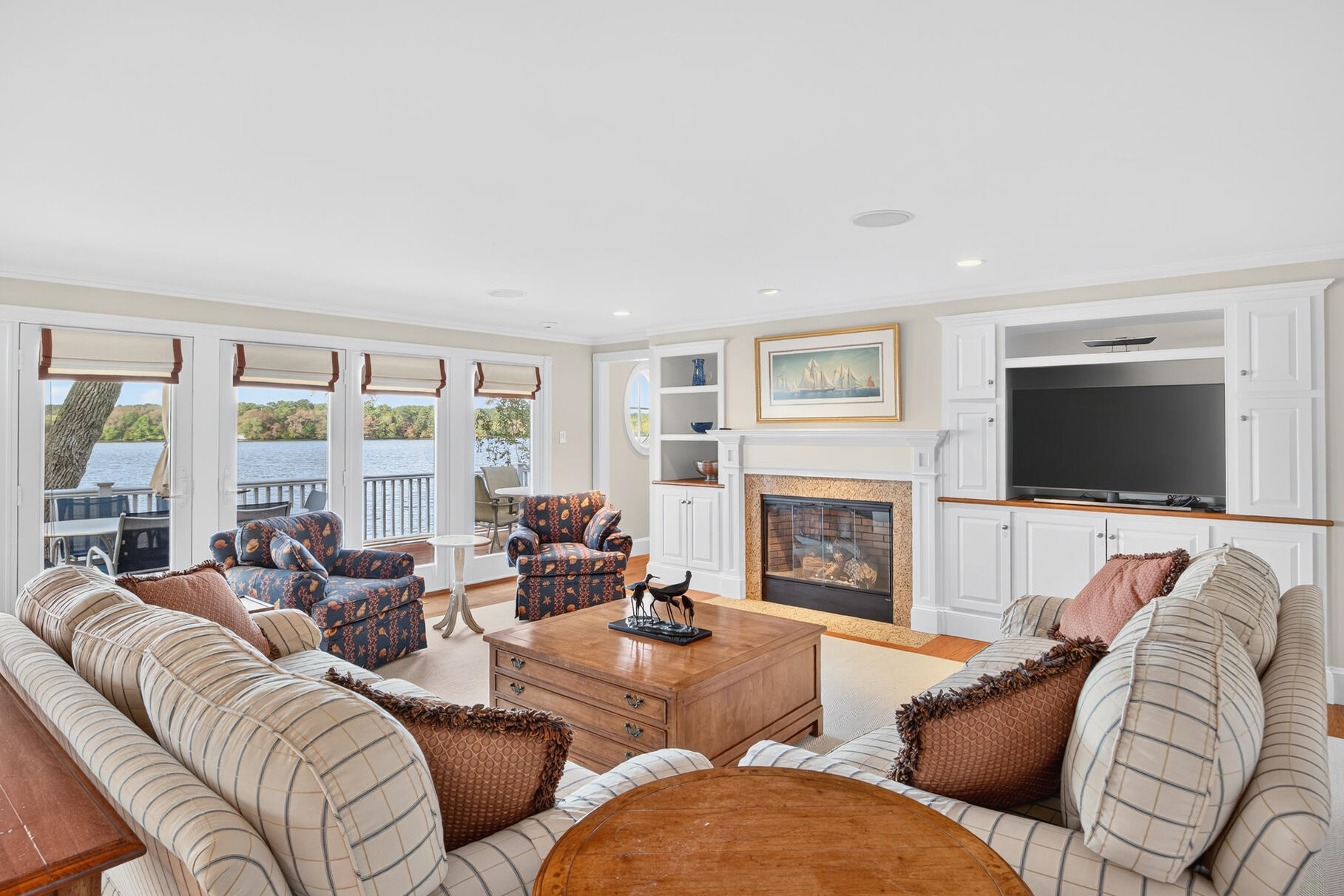 10 Brian Way Harwich, MA 02645 - Photo 21 of 76 a living room with furniture fireplace and a flat screen tv