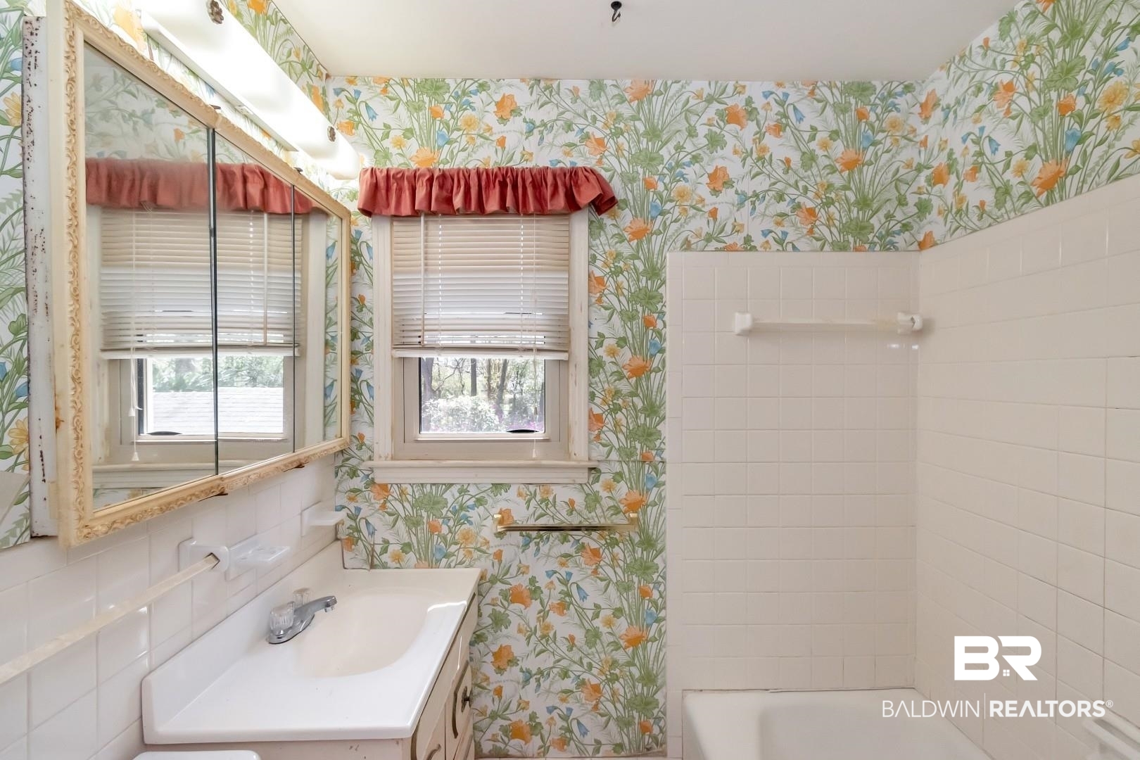3715 South Conway Drive Mobile, AL 36608 - Photo 11 of 24 Full bath with wallpapered walls, vanity, and bathing tub / shower combination