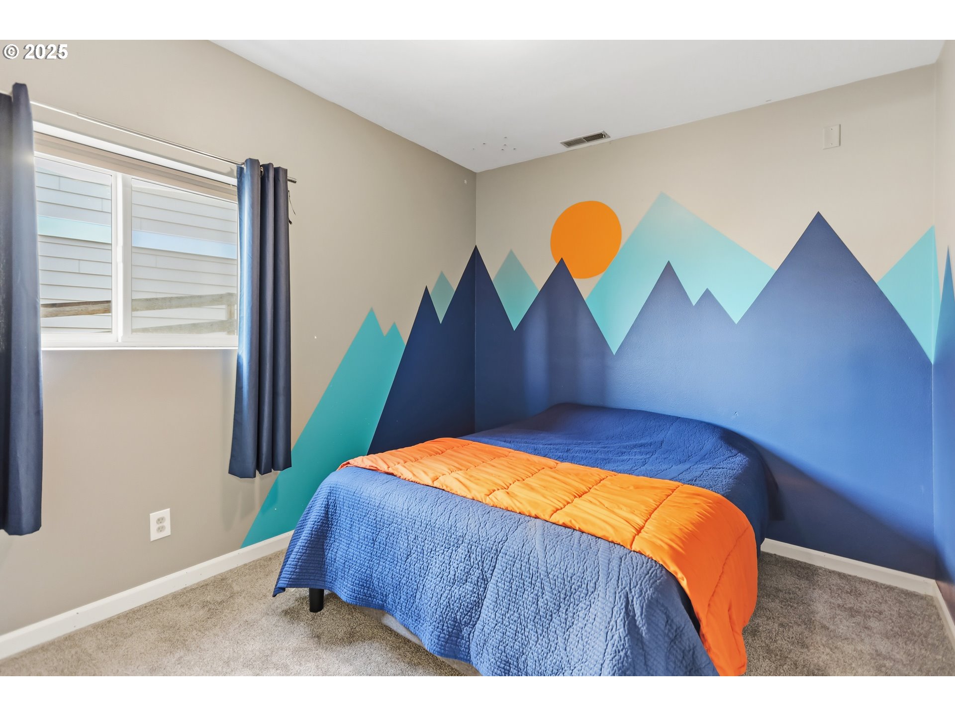 522 West 22nd Street The Dalles, OR 97058 - Photo 12 of 26 a bedroom with a bed and painting on the wall